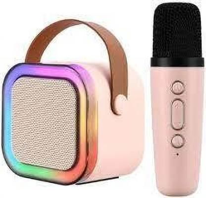 Pink microphone and colorful speaker on a white background
