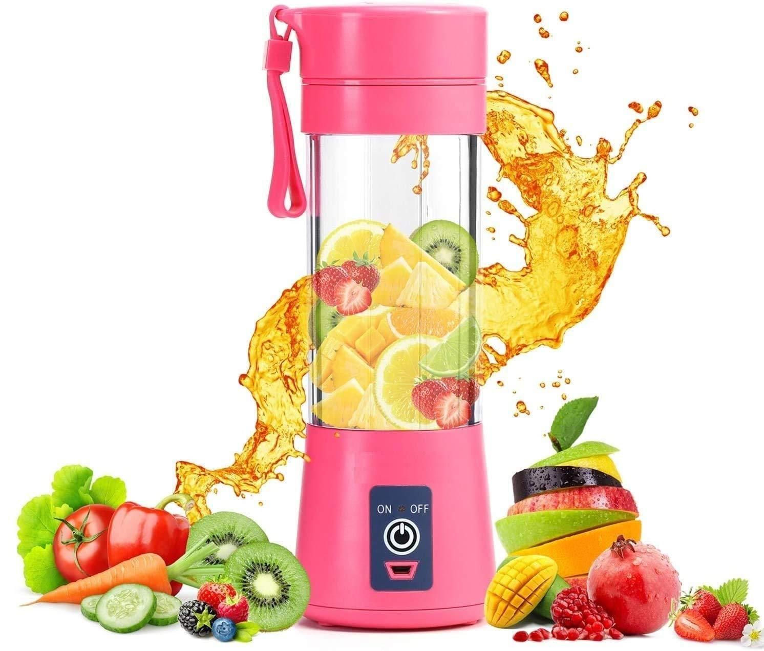 Pink portable blender with fruits inside on a white background