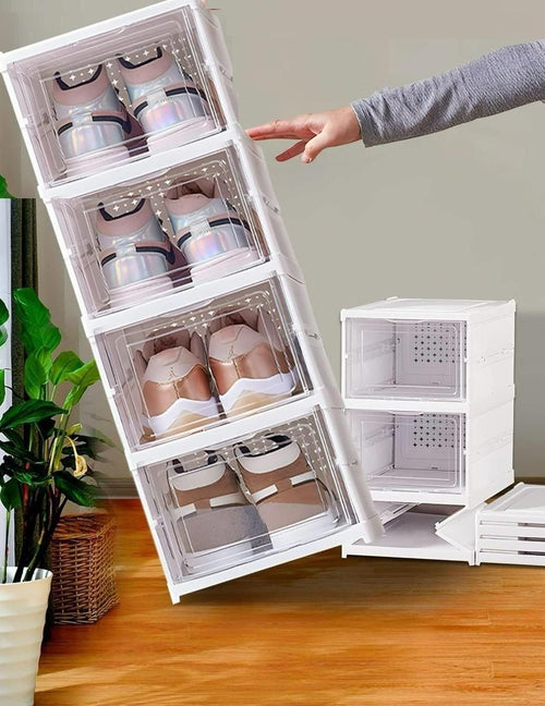 Stackable shoe storage boxes with shoes inside, on a wooden floor.